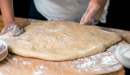 baker kneading dough