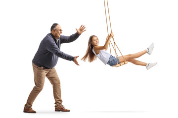 Wall Mural - Grandfather pushing granddaughter on a swing