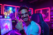 © Arsenii - Cheerful professional gaming streamer wearing headphones and eyeglasses greets his followers and subscribers on the stream with gesturing. Streaming and game Industry concepts. Generative AI