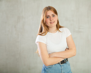 Portrait of a young girl on grey background studio portrait