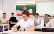 © JackF - A young student is carefully recording a lecture by a school teacher
