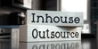 Outsource, inhouse - words on wooden blocks - 3D illustration