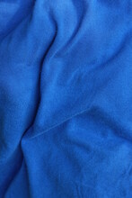 Texture Of A Fabric From A Piece Of Crumpled Blue Cloth