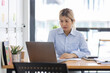 © David - Asian Business woman using calculator and laptop for doing math finance on an office desk, tax, report, accounting, statistics, and analytical research concept