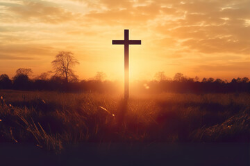 silhouette christian cross on grass in sunrise background