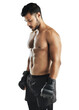 © Khushboo Sumeet/peopleimages.com - Fitness, thinking and a man exercise with boxing gloves isolated on a transparent, png background. Shirtless male athlete person, boxer or aesthetic model training for a fight, strong muscle or mma