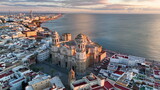 Fototapeta Konie - aerial view of old cathedral in Cadiz at sunset, Andalucia, Spain