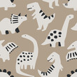 Cute dinosaur seamless pattern. Perfect for kids fabric, textile, nursery wallpaper. Hand drawn dino design. Vector illustration.