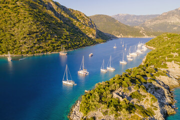 Wall Mural - Aerial shot of pleasure yachts anchored in laguna with crystal clear turquoise sea