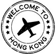 Grunge black welcome to hong kong with airplane icon round rubber seal stamp on white background