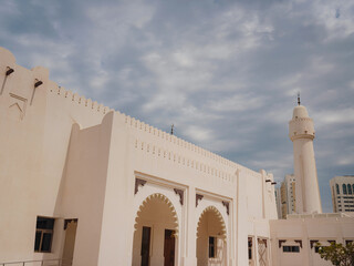 Wall Mural - Travel to Abu Dhabi in UAE. contrast between modern architecture and traditional mosques