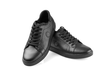 black leather sneakers on a white background