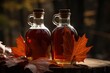 Delicious organic maple syrup in glass bottles on a table with leaves. Generative AI
