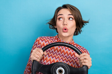 Sticker - Photo portrait of lovely young lady hold steering wheel look empty space dressed stylish striped garment isolated on blue color background