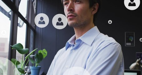 Poster - Animation of profile icons floating over thoughtful caucasian man looking out of window at office