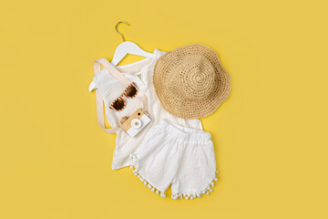 White Cotton T-shirt with shorts. Stylish baby clothes and accessories for summer. Fashion kids outfit. Flat lay, top view