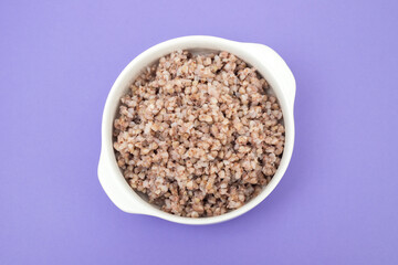 Sticker - boiled green buckwheat on a white bowl