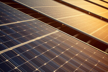 Photovoltaic Solar Panels. Renewable Energy Concept, Producing Clean Ecological Electricity At Sunset. High Quality Photo