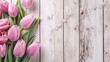 pink tulips on wooden background - happy birthday text sign on pink tulips on white rustic wooden background. spring top view of flowers in soft morning light with space for text, Generative AI