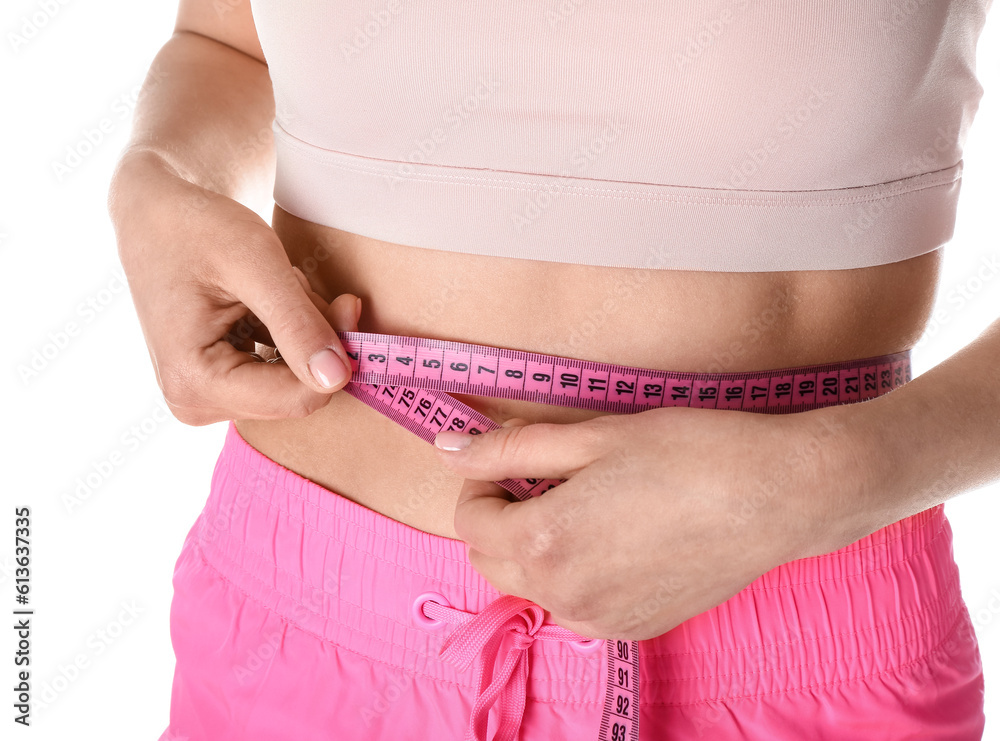 Young woman with measuring tape on white background. Diet concept