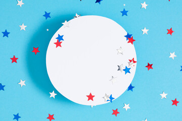 Wall Mural - 4th of July, USA Presidents Day, Independence Day. Flat lay top view of celebration decor, circle for text twinkling confetti on blue background, promotion or greeting message