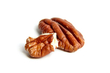 Wall Mural - Pecan nut kernels isolated on a white background. Heap of peeled pecan halves