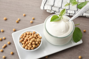 Wall Mural - Soy yogurt and grains on plate on wooden bench