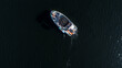Aerial top view of a wake boat navigating the open river 