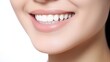 © SayLi - a close up photo of the lower part of a female face. beautiful cute smile with very clean perfect teeth. chin, nose and mouth visible. dental service advertisement. white background. Generative AI