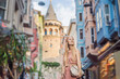 Portrait of beautiful woman tourist with view of Galata tower in Beyoglu, Istanbul, Turkey. Turkiye