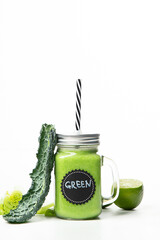 Wall Mural - Healthy green smoothie  in a jar mug  on white background