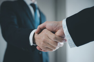 Businessman handshake for teamwork of business merger and acquisition,successful negotiate,hand shake,two businessman shake hand with partner to celebration partnership and business deal concept