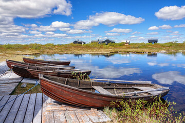 Sticker - Row boats at a jetty and mountain huts