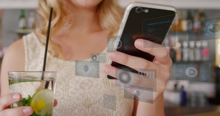 Poster - Animation of data processing against mid section of caucasian woman enjoying a drink at a bar