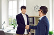 © Studio Romantic - Smiling young businessman in suit shaking hand to his partner after meeting in modern office. Good contract, deal, business achievement, partnership, cooperation agreement and teamwork concept.