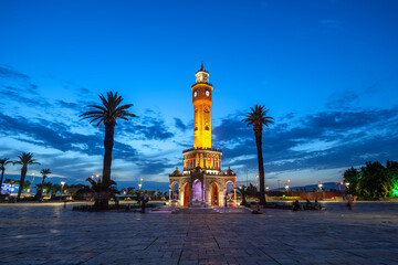 Wall Mural - Evening illuminated view of the clock tower in Izmir Konak Square