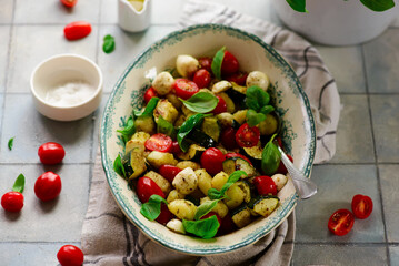 Canvas Print - Italian Caprese salad with gnocchi and vegetables.. .style rustic