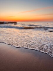 Wall Mural - Orange sea coast, twilights at the sea, sandy coastline, natural evening seascape background