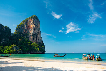 Wall Mural - Krabi, Thailand. Railay beach and long tail boats.	