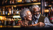 © PaulShlykov - Portrait of smiling senior couple drinking in bar