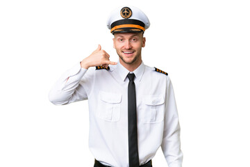 Wall Mural - Airplane pilot man over isolated background making phone gesture. Call me back sign