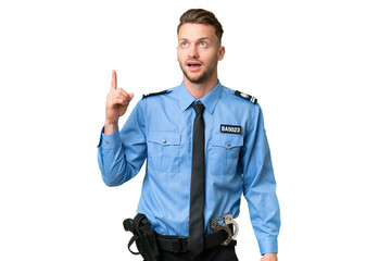 Wall Mural - Young police man over isolated background pointing up and surprised