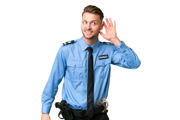 Sticker - Young police man over isolated background listening to something by putting hand on the ear