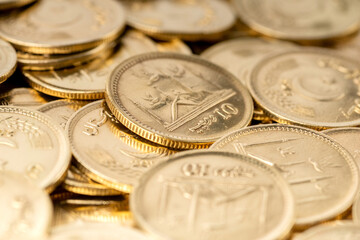 Wall Mural - Stacks of gold coins of Pakistani currency symbolize wealth and prosperity