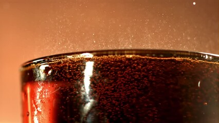 Poster - Cola drink in a glass with bubbles in the air. Filmed is slow motion 1000 fps. High quality FullHD footage