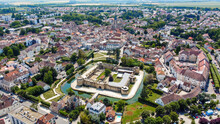 Aerial View Of The Square-based Medieval Castle Of Brie Comte Robert Surrounded With A Water-filled Moat In The French Department Of Seine Et Marne In The Capital Region Of Ile-de-France Near Paris