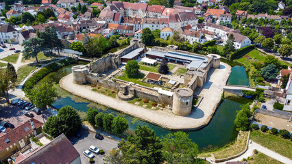 Sticker - Aerial view of the square-based medieval castle of Brie Comte Robert surrounded with a water-filled moat in the French department of Seine et Marne in the capital region of Ile-de-France near Paris