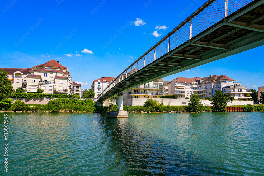Marne Riiver Footbridge spanning the Marne river to reach a residential neighborhood ...