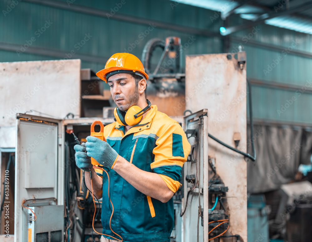 Stock-Foto „Electrical technician tests wiring, polarity, grounding