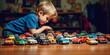 © AstralAngel - boy playing with toy cars
